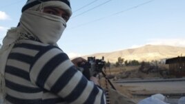 Free Syrian Army fighters are seen in Daria near Damascus, Syria, November 25, 2012.
