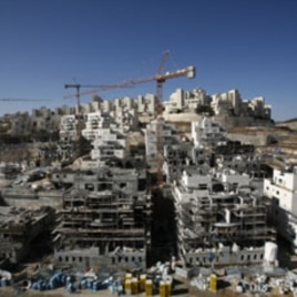 Houses under construction are seen in a Jewish settlement near Jerusalem known to Israelis as Har Homa and to Palestinians as Jabal Abu Ghneim, 08 Dec 2010