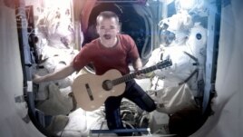 Canadian astronaut Chris Hadfield sings aboard the International Space Station, May 12, 2013.