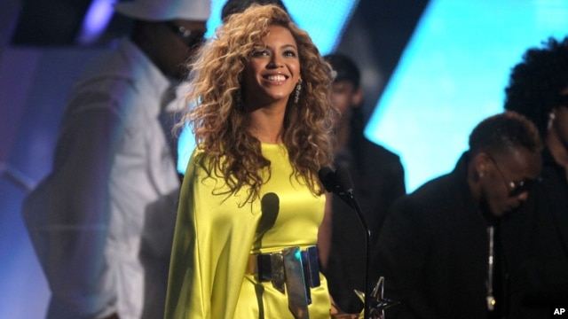Beyonce accepts the award for best female R& B at the BET Awards on July 1, 2012, in Los Angeles. 