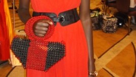 Model poses with a handbag made from recycled paper and beads by Cameroon businesswoman Jacqueline Kamsu. (Kamsu)