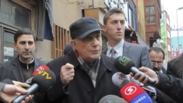Retired General Cetin Dogan (C) speaks to the media before surrendering himself at a courthouse in Istanbul, February 14, 2011.