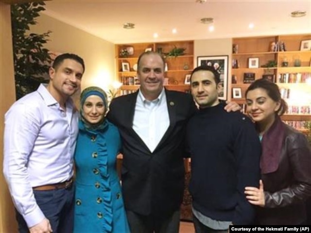 U.S. Rep. Dan Kildee of Michigan meets with former Iran prisoner Amir Hekmati, second from right, at Landstuhl Regional Medical Center in Landstuhl, Germany. Hekmati's family members are with them.