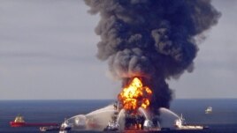 Fire boat response crews battle the blazing remnants of the offshore oil rig Deepwater Horizon, off Louisiana, in this April 21, 2010 handout image. 
