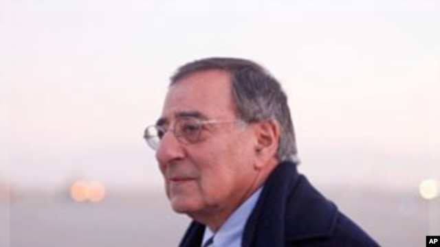 Defense Secretary Leon Panetta walks across the tarmac upon his arrival in Kabul,  Dec., 13, 2011