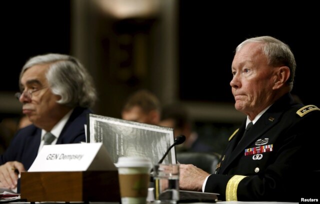 Chairman of the Joint Chiefs of Staff U.S. Army General Martin Dempsey, right, along with Energy Secretary Ernest Moniz, left, appear before the Senate Armed Services Committee in Washington, July 29, 2015.