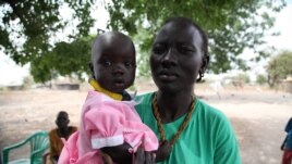 Members say the bank has made it possible to pay for their children's education and medical fees, Rumbek, Lakes State, South Sudan, Jan. 30, 2013. (H. McNeish/VOA)