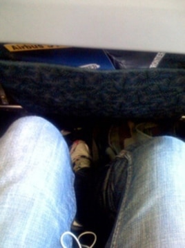 My, but this row offers a lot of legroom. Plenty of room next to you if you get the middle seat, too, no doubt.