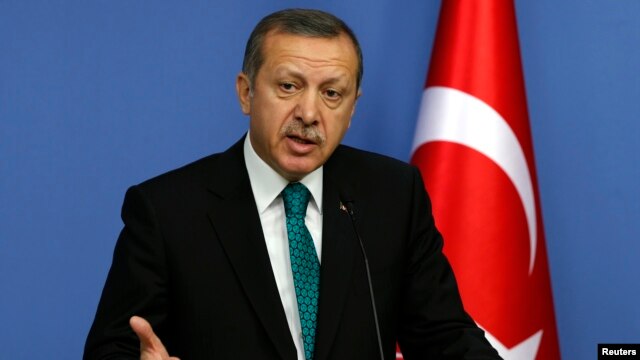 FILE - Turkey's Prime Minister Tayyip Erdogan addresses the media in Ankara, Nov. 13, 2013. 