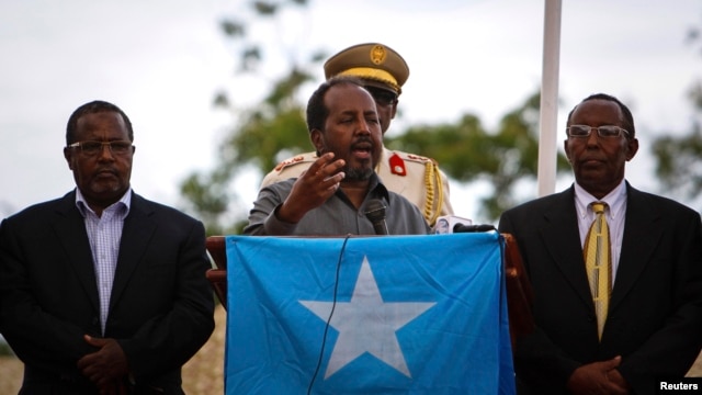 Somali President Hassan Sheikh Mohamud speaks during a military parade marking the 53rd anniversary of the Somali National Army in Mogadishu, Somalia, April 12, 2013.
