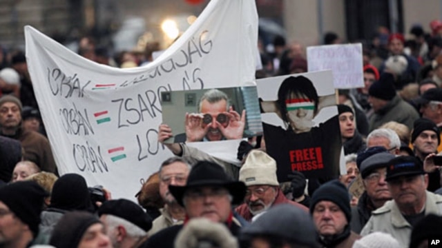 Thousands of protesters demonstrate against the Hungarian government in front of the parliament building in Budapest, December 23, 2011