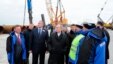 Russian President Vladimir Putin (S) visits the construction site of the Kerch Strait bridge on Tuzla Island, Crimea, March 18, 2016. Putin traveled to Crimea to mark the second anniversary of the peninsula's seizure from Ukraine.