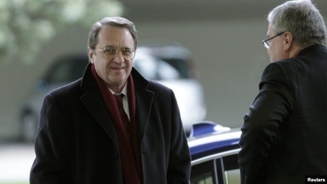 Russia's Deputy Foreign Minister Mikhail Bogdanov (L) arrives at the United Nations European headquarters in Geneva, January 11, 2013.