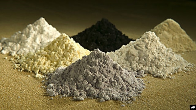 Rare earth oxides from top center clockwise: praseodymium, cerium, lanthanum, neodymium, samarium, and gadoliniun, October 7, 2010.