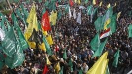 Palestinians celebrate the Israel-Hamas cease-fire in Gaza City, November 22, 2012.