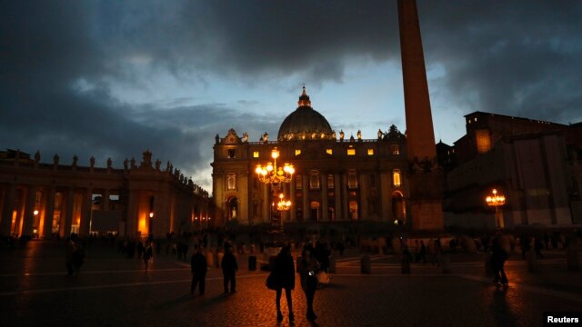 People walk in Saint Peter's Square at the Vatican, March 7, 2013.