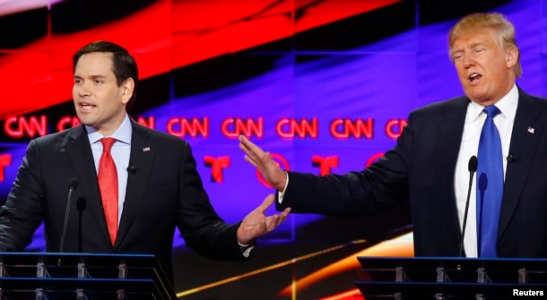 FILE - Republican U.S. presidential candidates Marco Rubio (L) and Donald Trump speak simultaneously at the debate sponsored by CNN for the 2016 Republican U.S. presidential candidates in Houston, Texas, Feb. 25, 2016.