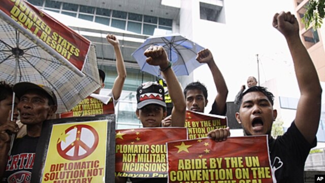 Demonstrators  protest against what Manila claims to be Chinese intrusions into Spratly Islands territories claimed by the Philippines front of the Chinese consulate in Makati's financial district of Manila June 8, 2011.