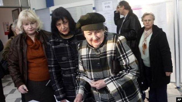 Voters wait for their ballots at a polling station in Zagreb, Croatia, December 4, 2011.