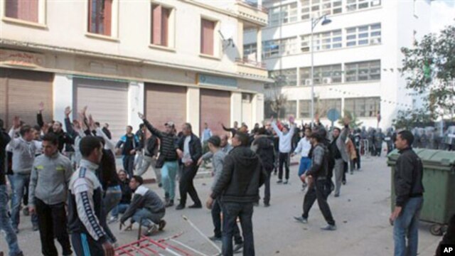 Algerian youth protesters clash with riot police in Annaba, February  13, 2011