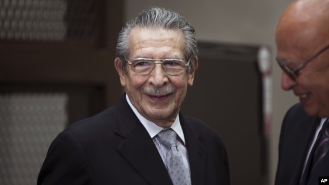 Guatemala's former dictator Jose Efrain Rios Montt, left, smiles as he attends his hearing in Guatemala City, Jan. 28, 2013.