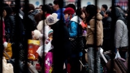 Passengers at the Beijing railway station on February 5, 2013 are among millions returning home for the Chinese Lunar New Year, which starts February 10, 2013.