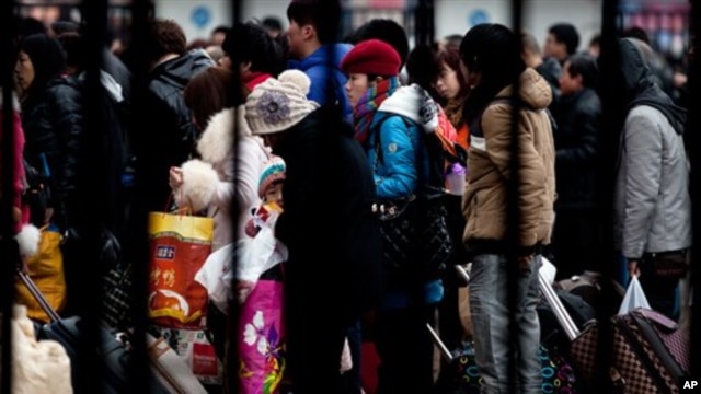 Passengers at the Beijing railway station on February 5, 2013 are among millions returning home for the Chinese Lunar New Year, which starts February 10, 2013.