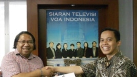 Maman Firmansyah (kanan) pemenang utama periode Juni.