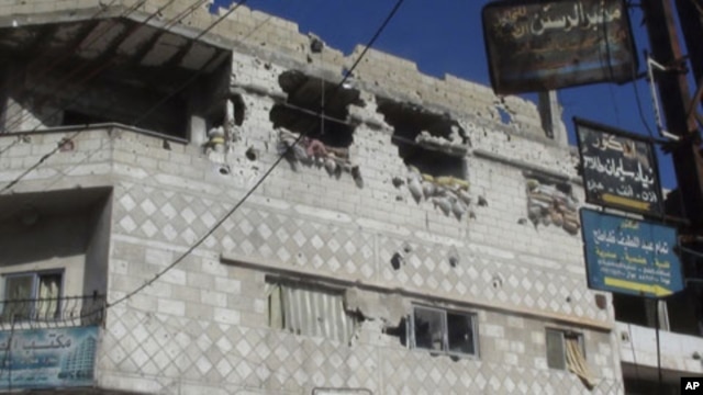 A view of houses that residents said were damaged during a military crackdown on protesters against Syrian President Bashar al-Assad, is seen in Rasten near Homs, February 3, 2012.