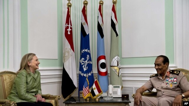 U.S. Secretary of State Hillary Rodham Clinton, left, meets with Field Marshal Hussein Tantawi, right, at the Ministry of Defense in Cairo, Egypt, July 15, 2012.