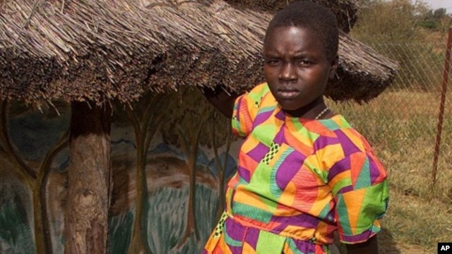 Nighti Aparo stands in her village in northern Uganda. Aparo was kidnapped, raped at gunpoint and tortured by the Lords Resistance Army. (OXFAM handout, file photo)