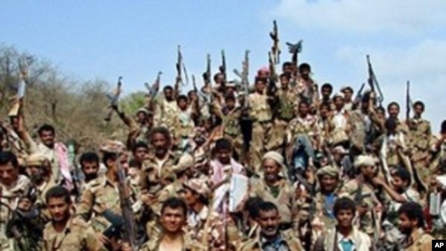 Yemeni soldiers and tribe members after a battle against al-Houthi Shiite rebels in northern Yemen. Saudi Arabia's Deputy Defense Minister said the rebels have been forced over the border back into Yemen (file photo)