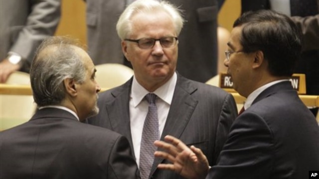 Syria's U.N. Ambassador Bashar Ja'afari (L), speaks to Russia's U.N. Ambassador Vitaly Churkin (C), and China's deputy U.N. Ambassador Wang Min before the United Nations General Assembly passed a draft resolution condemning Syria, at the United Nations in