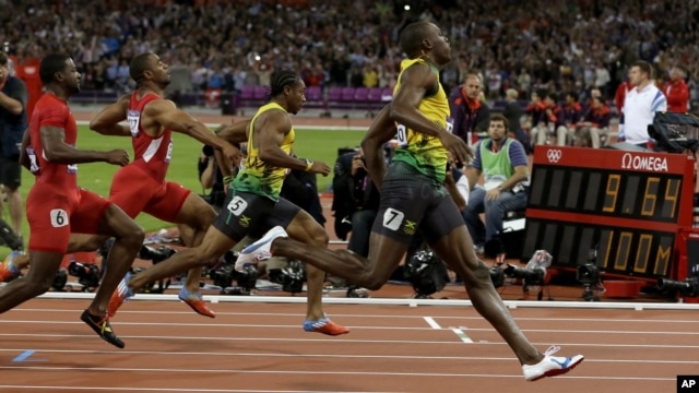 Jamaica's Usain Bolt, right, wins the men's 100-meter final during the athletics in the Olympic Stadium at the 2012 Summer Olympics, London, Sunday, Aug. 5, 2012.
