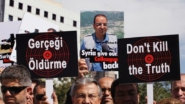 Turkish journalists demand Syria free their colleagues during a march to the Syrian Embassy in Ankara, Aug. 31, 2012.