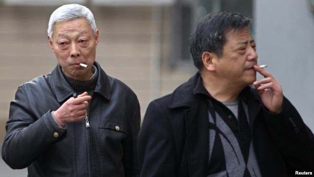Smokers in a street in Shanghai, China, March 22, 2012. 
