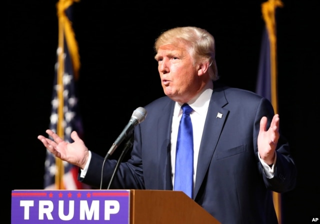 FILE - Republican presidential candidate Donald Trump speaks during a campaign town hall, at Pinkerton Academy in Derry, New Hampshire, Aug. 19, 2015.