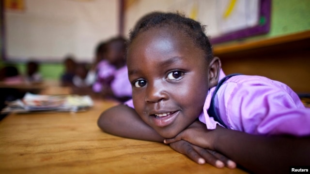 FILE - A four-year-old deaf student sits inside her classroom in the specialized deaf unit program at the Little Rock Inclusive Early Childhood Development Center in Kenya's capital Nairobi.