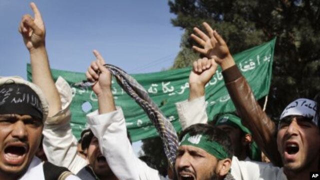 University students of Nangarhar shout anti-U.S. and Afghan government slogans during a demonstration in Jalalabad, east of Kabul, Afghanistan on November 20, 2011.