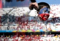 A young Chile fan watches the Netherlands/Chile match in Sao Paulo, Brazil.