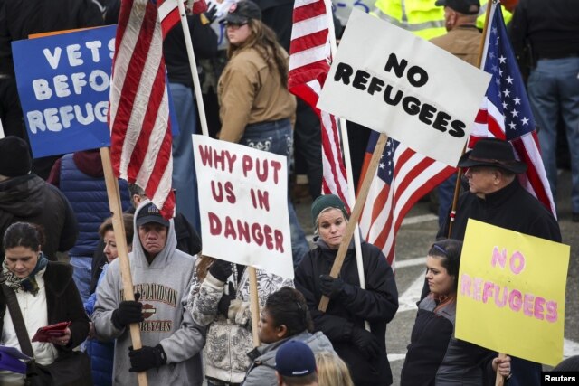 FILE - People gather to protest against the United States' acceptance of Syrian refugees in Olympia, Washington, Nov. 20, 2015.