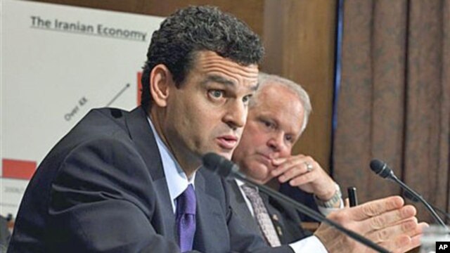 Treasury Undersecretary David Cohen (L), with Commerce Undersecretary David Mills, testifies before the Senate Banking Committee hearing 'Addressing Potential Threats from Iran: Administration Perspectives on Implementing New Economic Sanctions One Year L