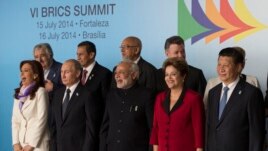 Leaders of the BRICS and South American nations pose for a group photo at the BRICS summit in Brasilia, Brazil, July 16, 2014.