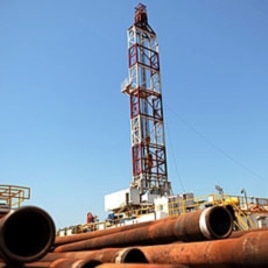 Drilling tubing is piled next to the drilling site number 102 in the Unity oil field in South Sudan (2010 file photo).