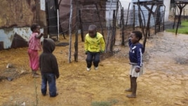 Children jump rope at the Tudor Shaft squatter settlement near Randfontein, west of Johannesburg, South Africa, January 26, 2011.