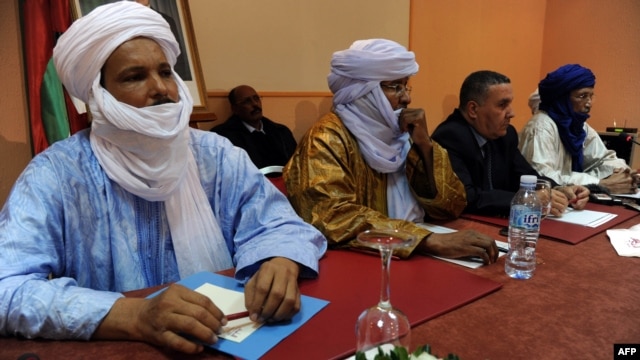Members of Ansar Dine and Tuareg National Movement for the Liberation of Azawad during a meeting in Algiers, Algeria, December 21, 2012.