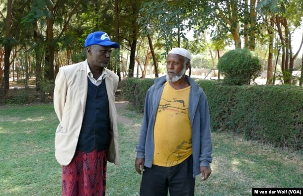 Community Elders Shumi Telila (left) and Ahmed Hamda (right) intervened when protestors were about to attack Maranque Plants, a foreign owned company, Oct. 4, 2016, in the Oromia region, Ethiopia.