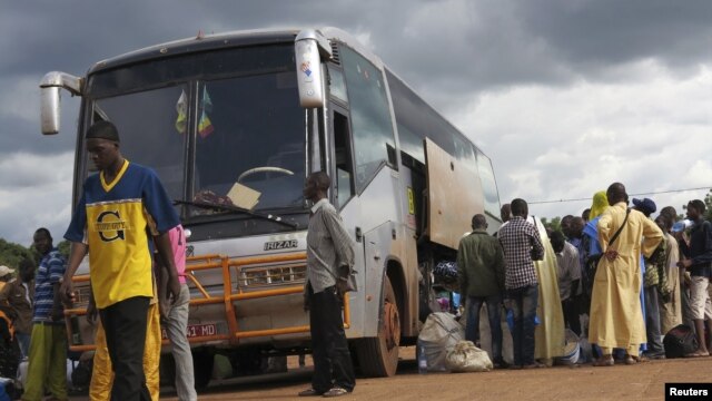Malians who fled unrest in the northeastern city of Gao wait at a bus station in Bamako to return home, Sept. 3, 2012.