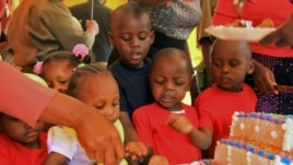 Children of female prisoners celebrate the opening of a new day care facility at the Langata Women's Prison in Nairobi, Jan. 23, 2013.