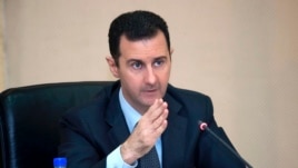Syria's President Bashar al-Assad in seen in February 12, 2013, file photo